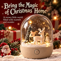 Christmas reindeer duo snow globe night light clean product shot showing two white reindeer, warm LED glow, and snow-dusted pine trees under glass dome